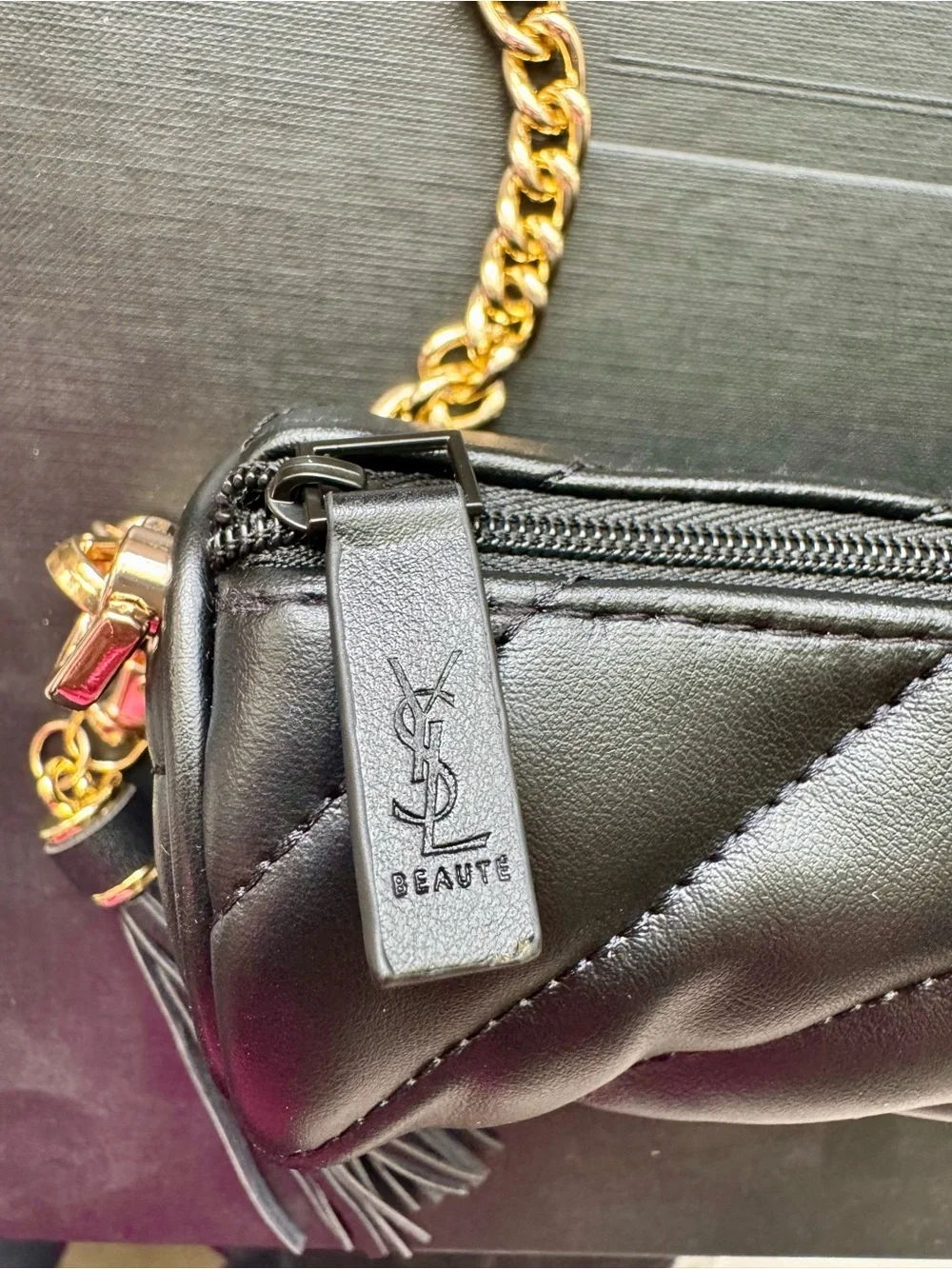 Yves Saint Laurent beauty Black faux leather makeup mini bag w/gold chain